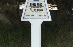 A road sign was placed near Utah Beach to commemorate Williard Begel’s sacrifice. Courtesy of Andrew Broyzna