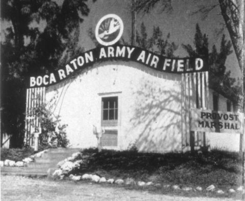 White building with sign over the front reading 'Boca Raton Army Air Field.'