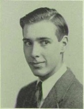 Jack Brindley in suit and tie looking at the camera.