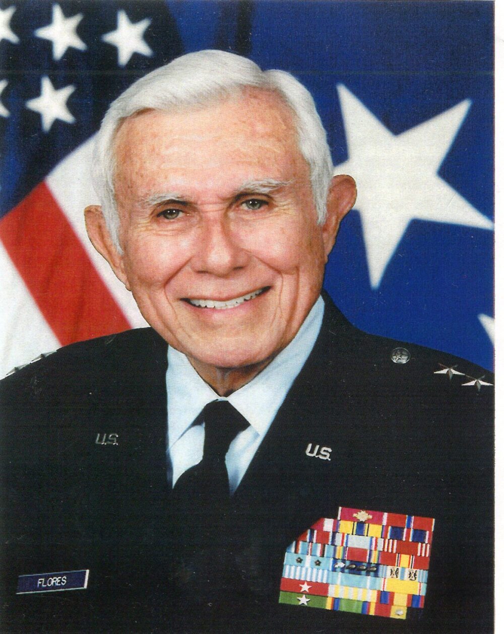 A retired general, wearing his military dress uniform with two stars on his shoulders.