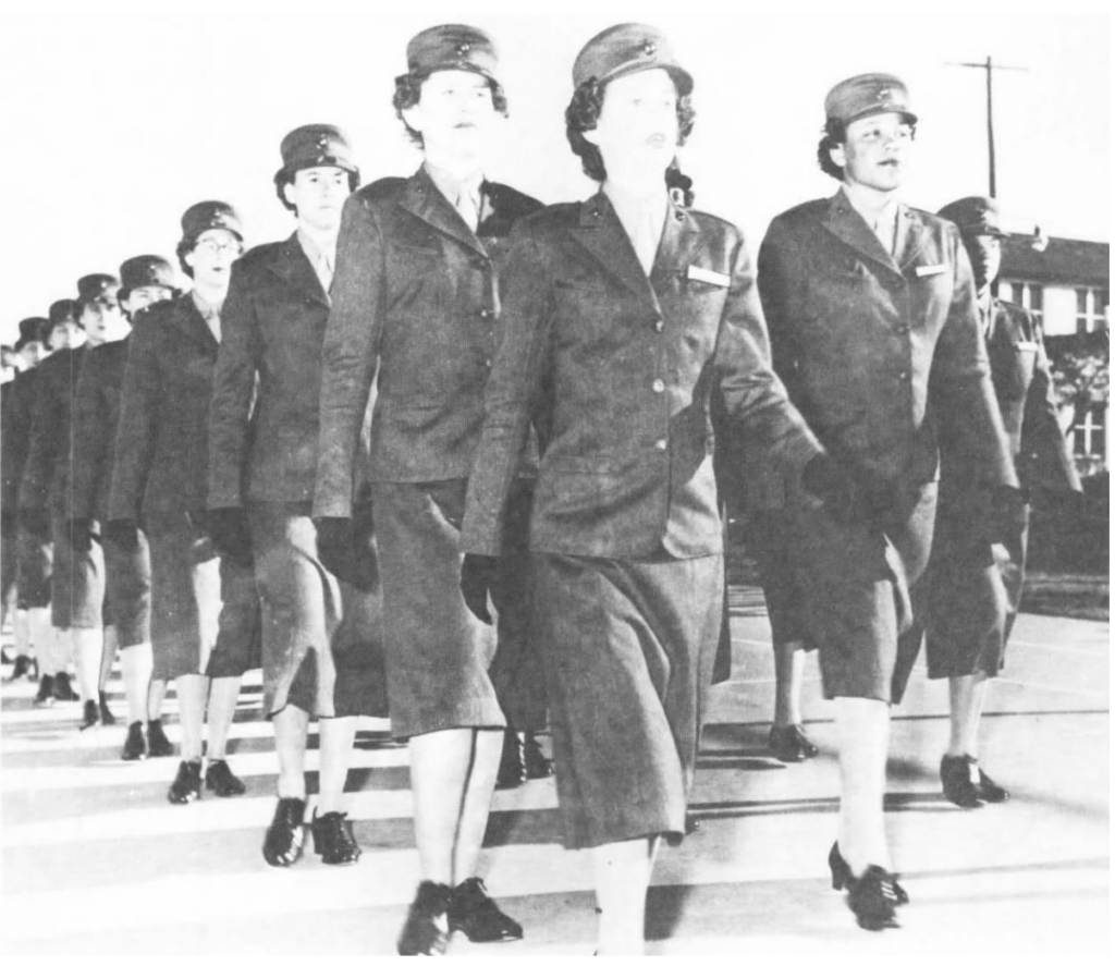 Female Marines in uniform marching in lines.