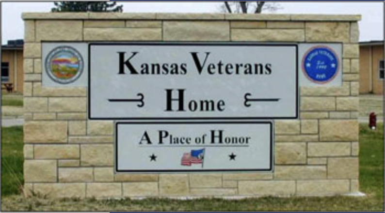 A large sign labeled, "Kansas Veterans Home" with a smaller sign underneath stating, "A Piece of Home."