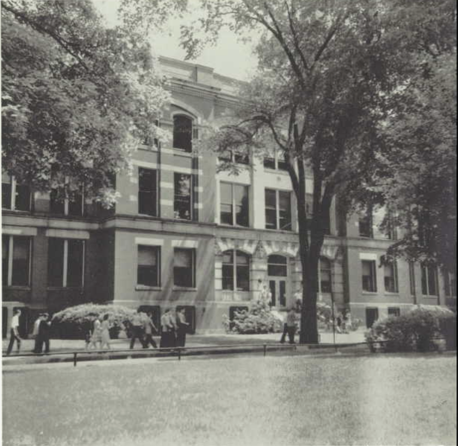 Black and white photograph of a three story brick school.