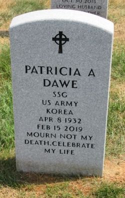 Photo of light gravestone with a dark etched cross and the name, Patricia A. Dawe.
