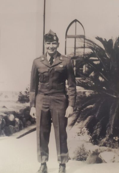 Photo of Dupris standing in his Army uniform.