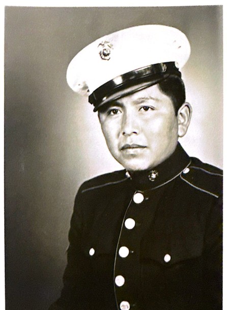 A young Apache man in a Marine Corps dress uniform.