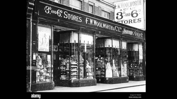 A black and white photo of the storefront of the F.W. Woolworth and Co. building.