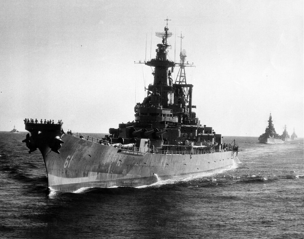 Photo of a large battleship at sea.