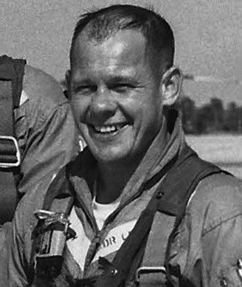A Navy pilot in a flight uniform.