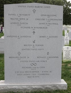 A large marble headstone with all of the names of those lost on the mission engraved. At the bottom it says “CH-53A Helicopter. Knife 31 Shot Down - KIA - Cambodia May 15 1975”