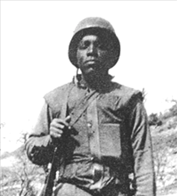 An African American medic in a combat gear and helmet in Korea.