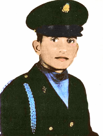 A young man in an Army dress uniform and hat.