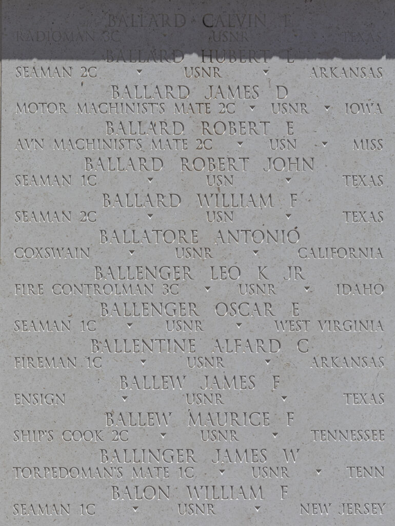 A photograph of a white marble wall with names, ranks, branches, and states engraved. Ballengers information is shown.
