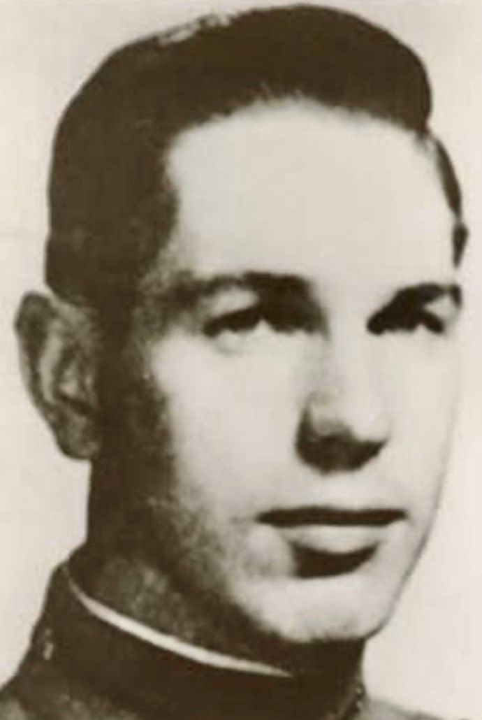 A black and white headshot of a young White man in uniform looking at the camera.