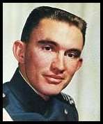 A color photo headshot of a White man in a uniform looking into the camera.