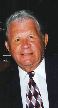 Carl Taylor in a black suit and tie.