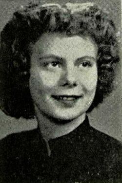 A black and white image of young White woman. She had chin-length, curly hair, and is wearing a dark colored shirt. 