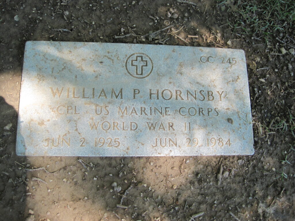 A flat, rectangular, headstone reading "William P Hornsby CPL US Marine Corps World War II JUN 2 1925 JUN 29 1984"