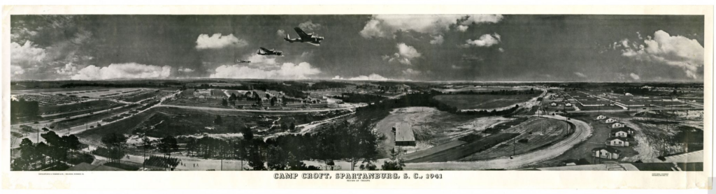 A black and white panoramic image of a three planes flying over a military base.