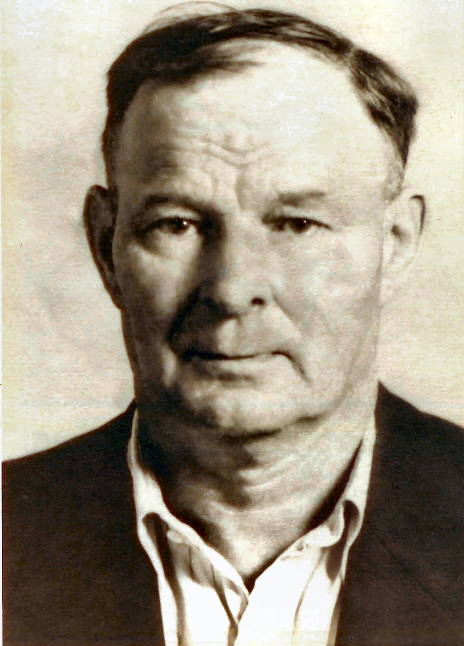 A middle age man in a dress shirt and sport coat.