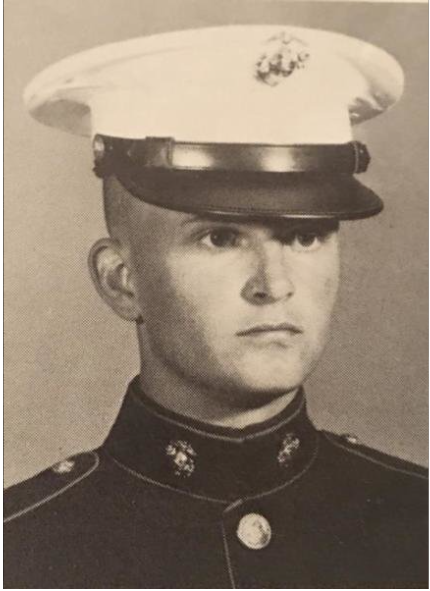 A young man in a Marine Corps dress uniform.