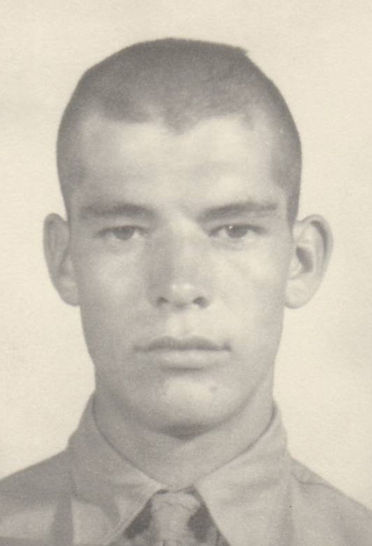 A young man with a buzz cut.