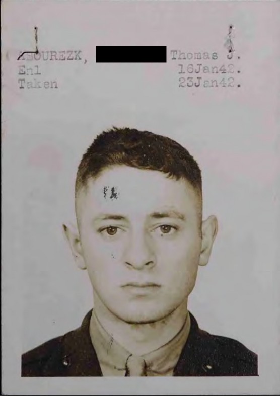 A black and white headshot photo of a young White man in uniform.