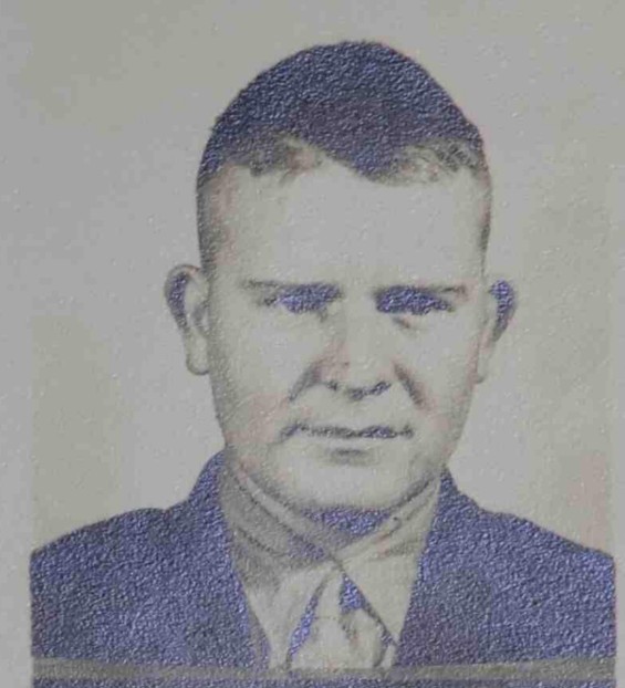 A black and white headshot image of a White young man in uniform.