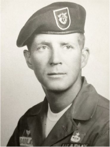 A young man in an Army uniform wearing a special forces beret.