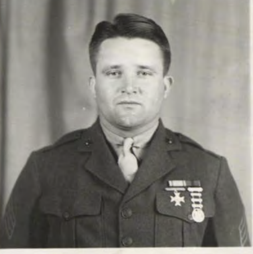 A man in a Marine Corps uniform with campaign ribbons.