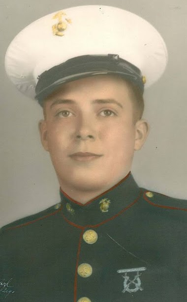 A young man in a Marine Corps dress uniform.