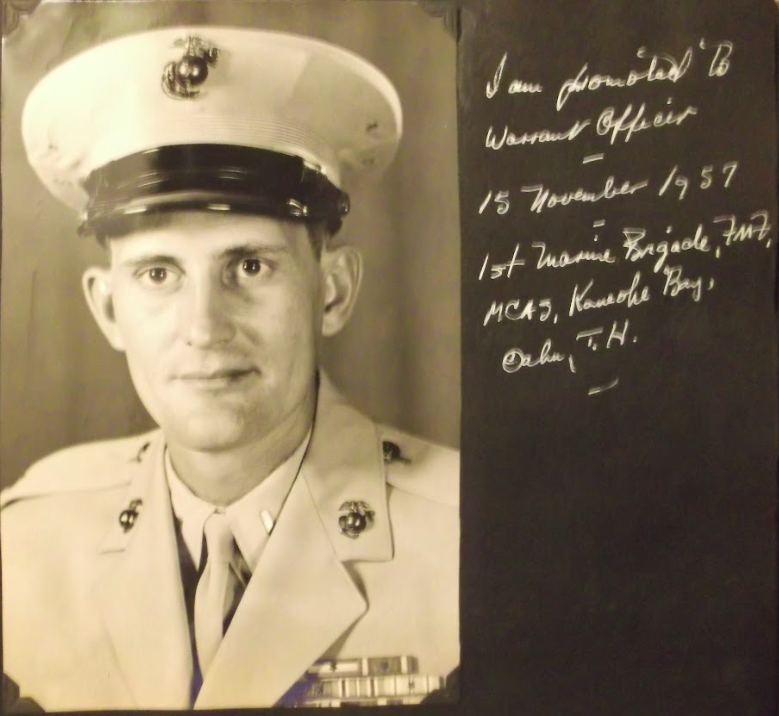 A black and white photo of a young White man in dress uniform. To the right of the image is a hand-written caption with the occassion and date.
