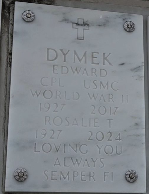 A white marble headstone.