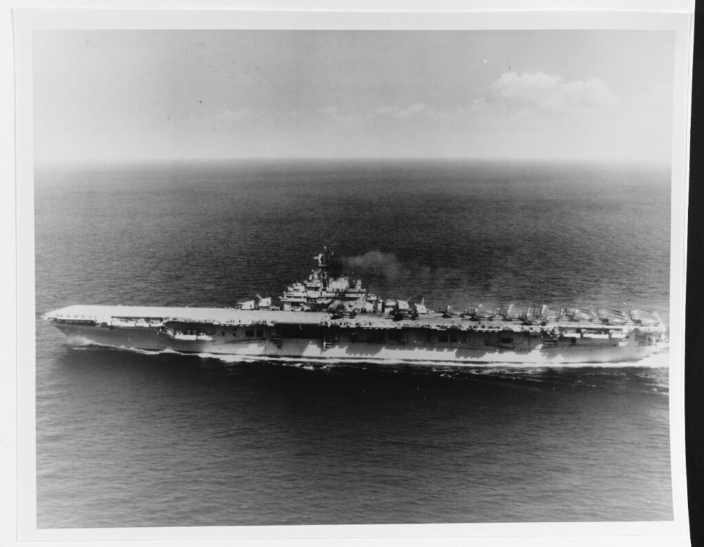 A black and white image of a ship in the sea.
