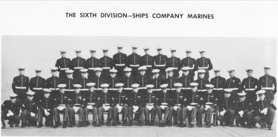A black and white photo of several dozen young White men in uniform under the heading “The Sixth Division-Ships Company Marines.”