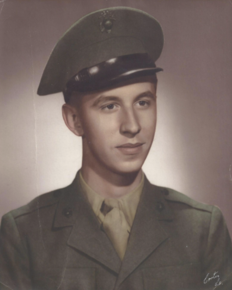 A color headshot photo of a young White man in uniform.