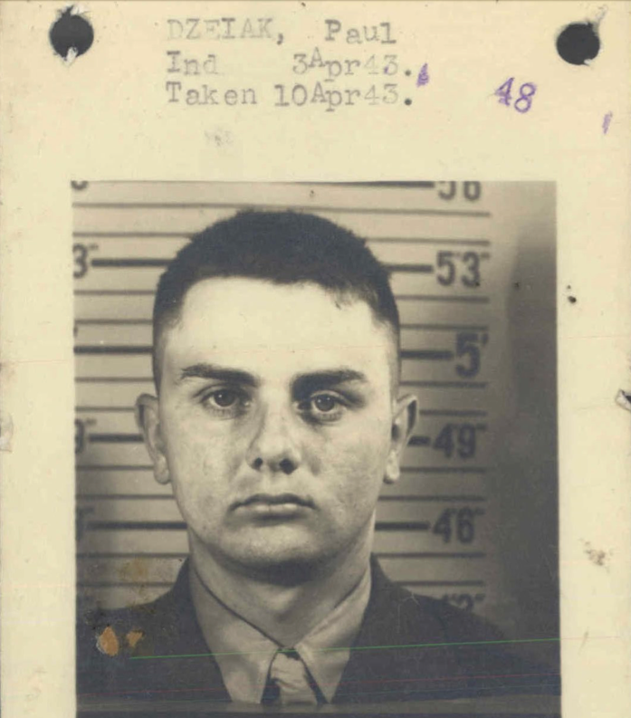 A black and white photo of a young White man in uniform. At the top of the image is “Dzeiak, Paul Ind 3Apr43. Taken 10Apr43.”