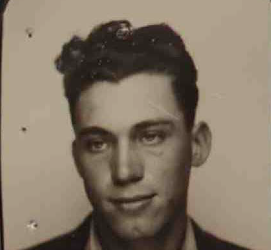 A young White man looking left.