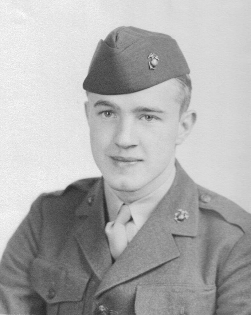A black and white headshot of a young White man in uniform.