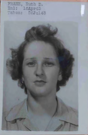 A young woman with short curly hair.