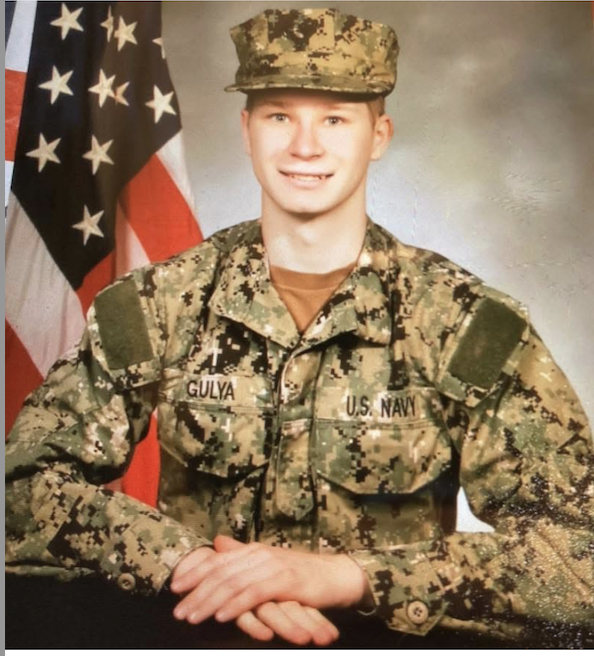 A color photo of a young White man in uniform. 
