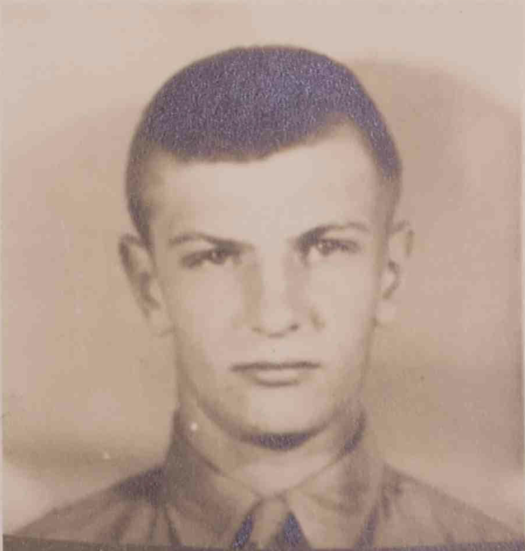 A sepia toned head shot of a young White man in uniform.