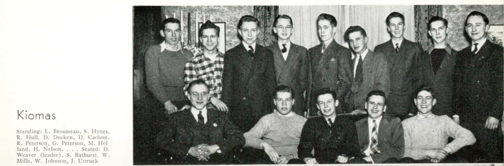 A black and white image of over a dozen young White men posing for a yearbook photo.