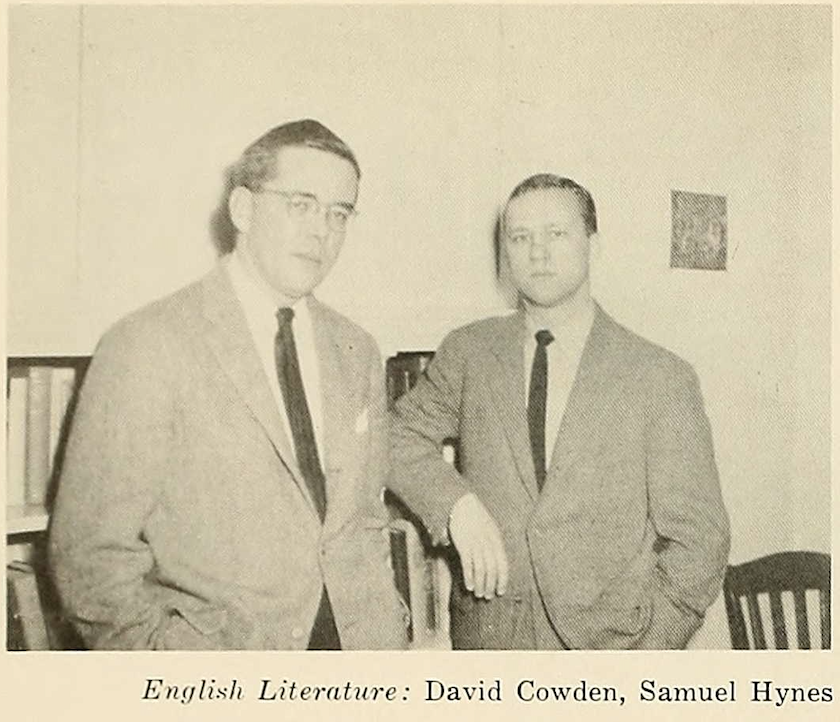 A black and white image of a younger and an older White man in a classroom.