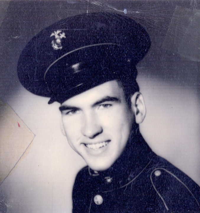 A black and white headshot of a young White man in a uniform.