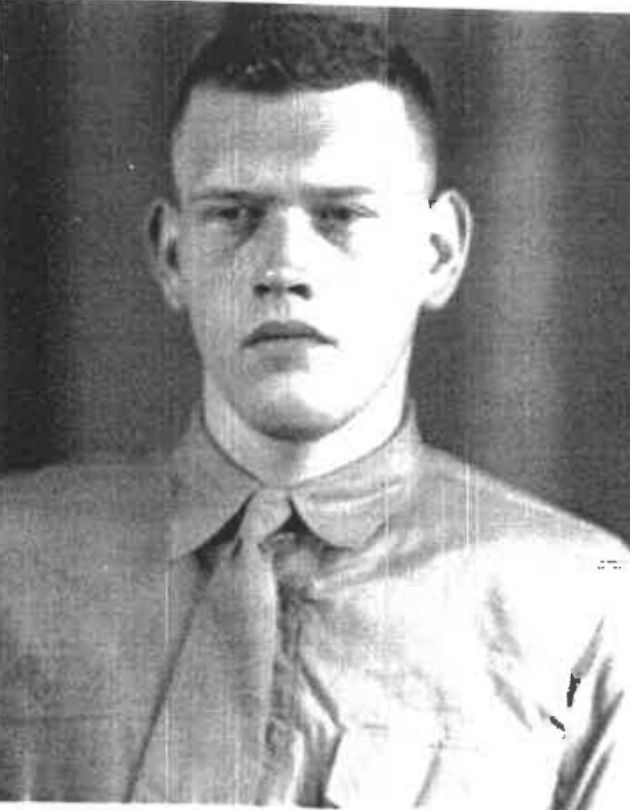 A black and white image of a young White man in uniform.