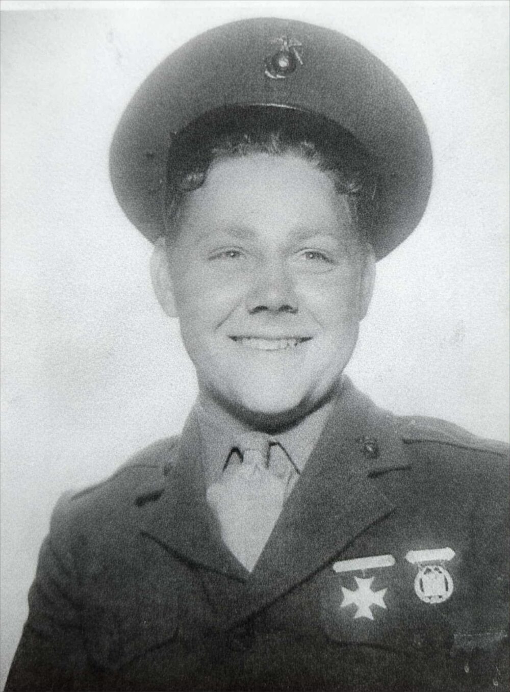 A young man in military uniform.