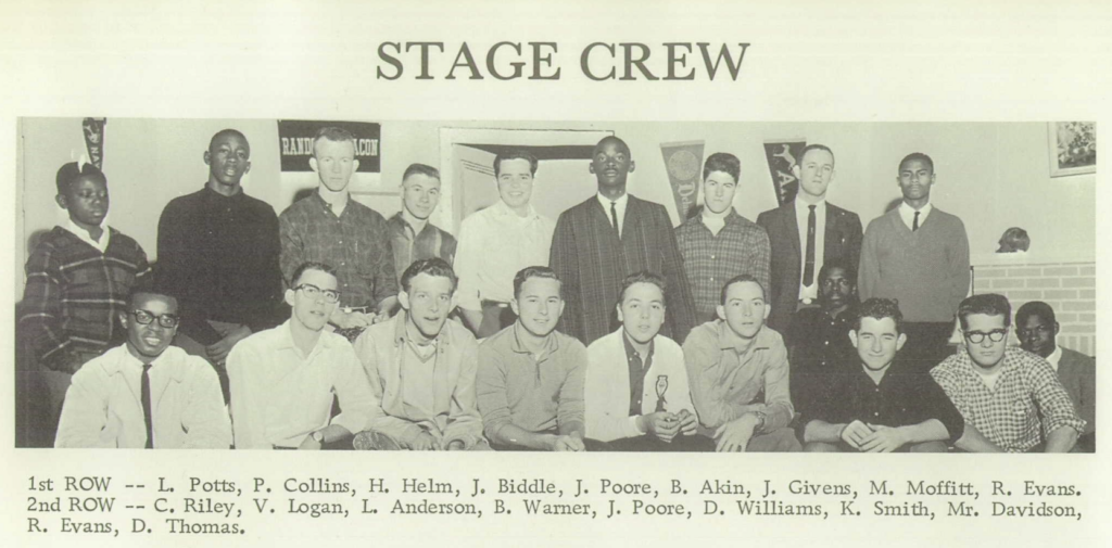 A black and white photograph of an interracial group of 19 young men posing for a yearbook picture.