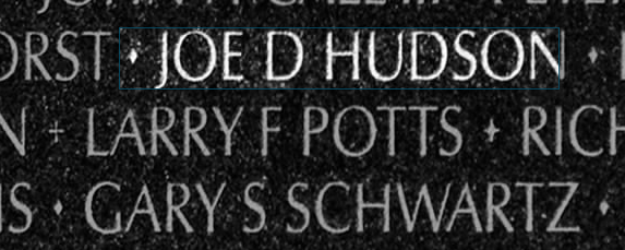Black marble engraved with “Larry F. Potts”