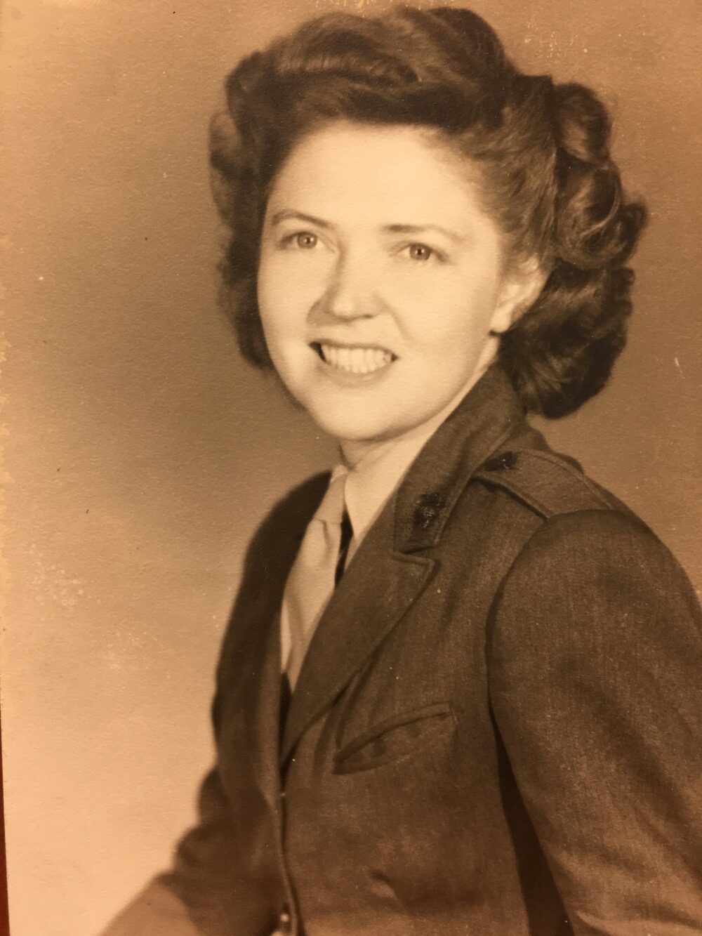 A young woman in her Marine Corps uniform.